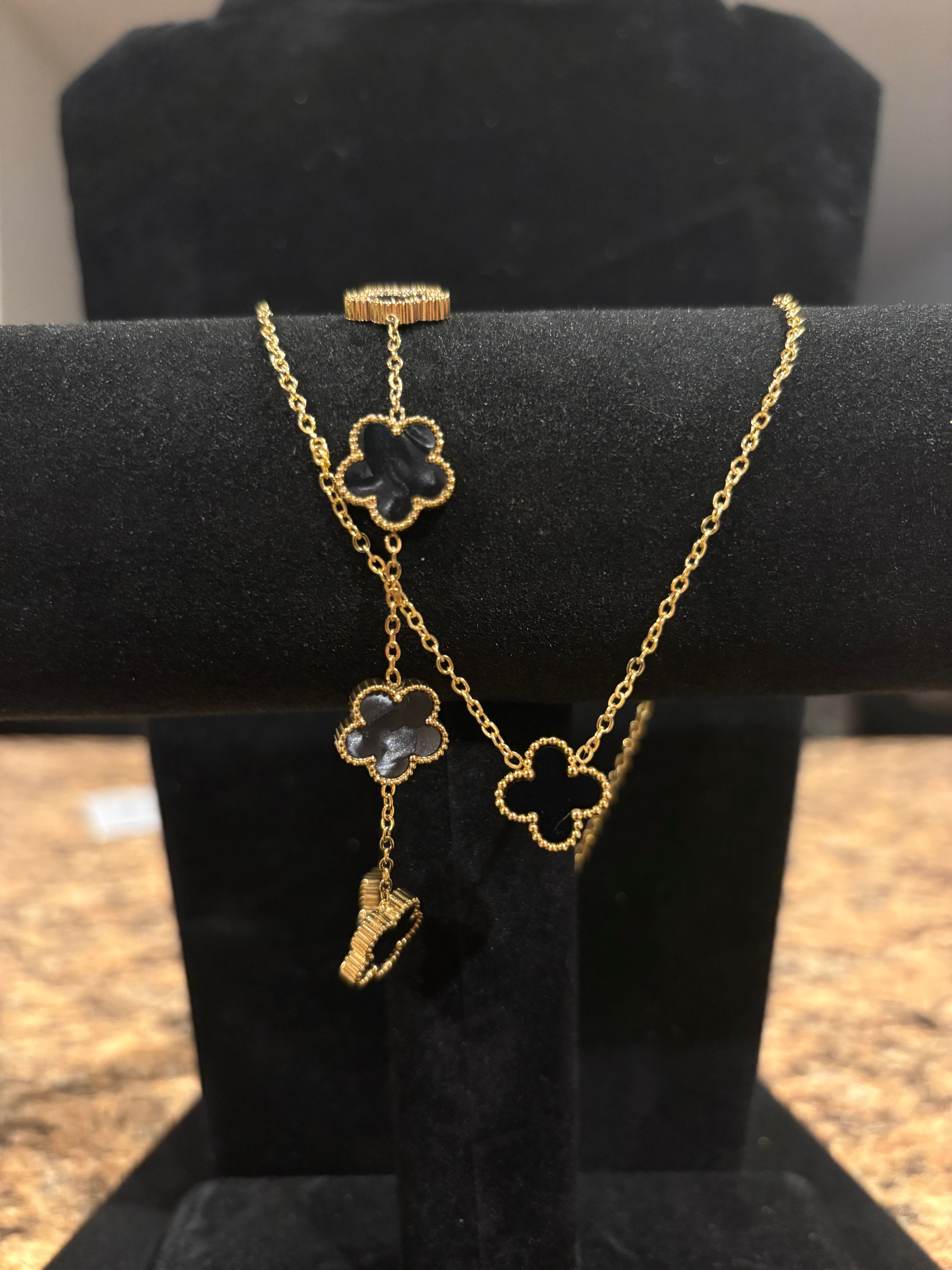 Noir Enchantment: Gold-Plated Black Clover Necklace & Bracelet Set