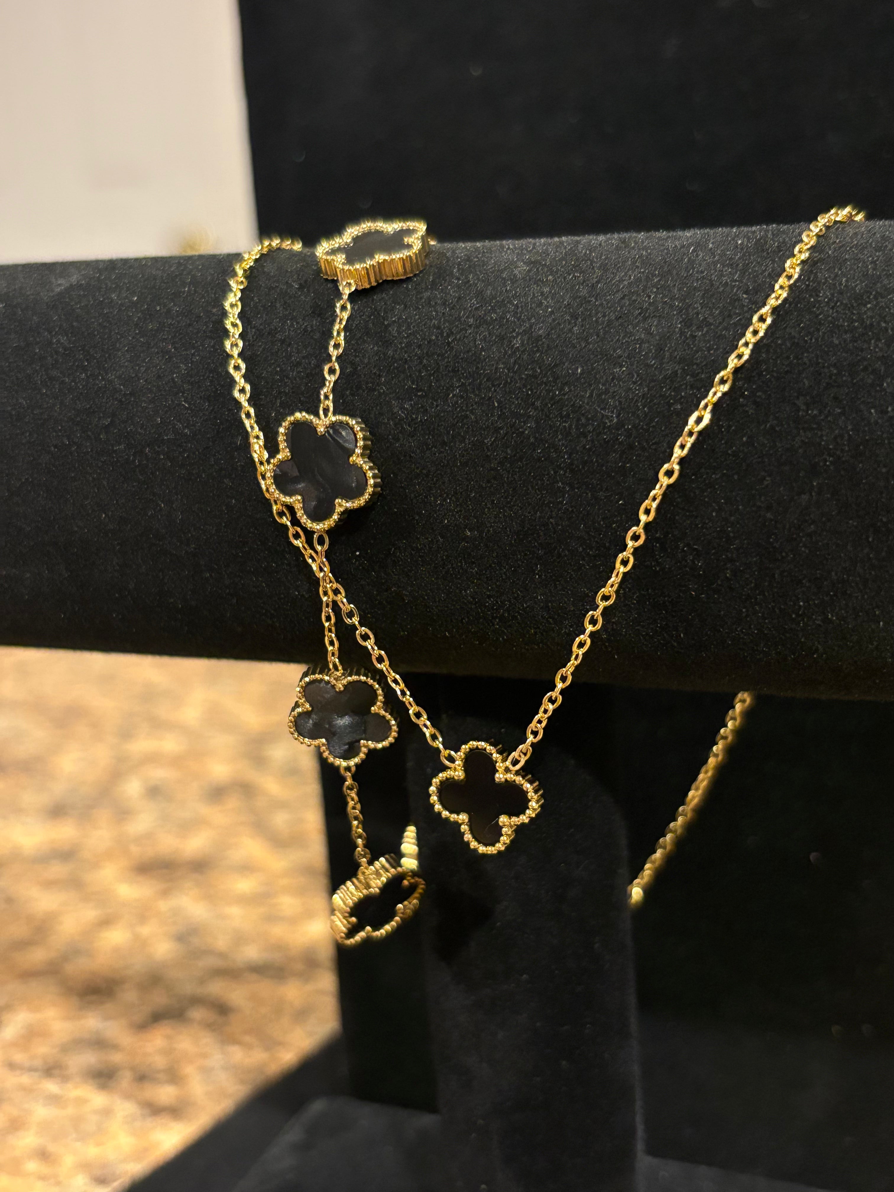 Noir Enchantment: Gold-Plated Black Clover Necklace & Bracelet Set