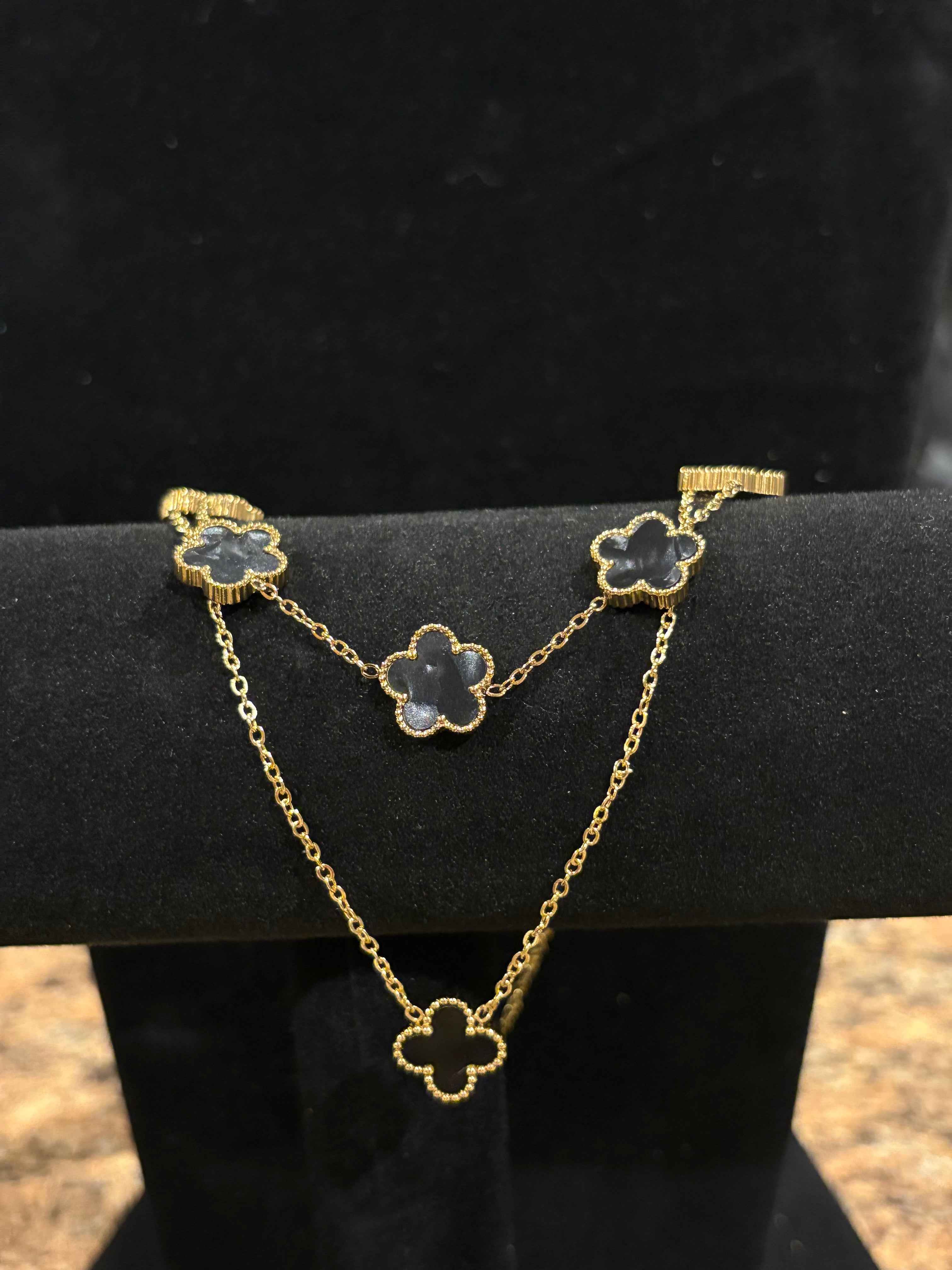 Noir Enchantment: Gold-Plated Black Clover Necklace & Bracelet Set