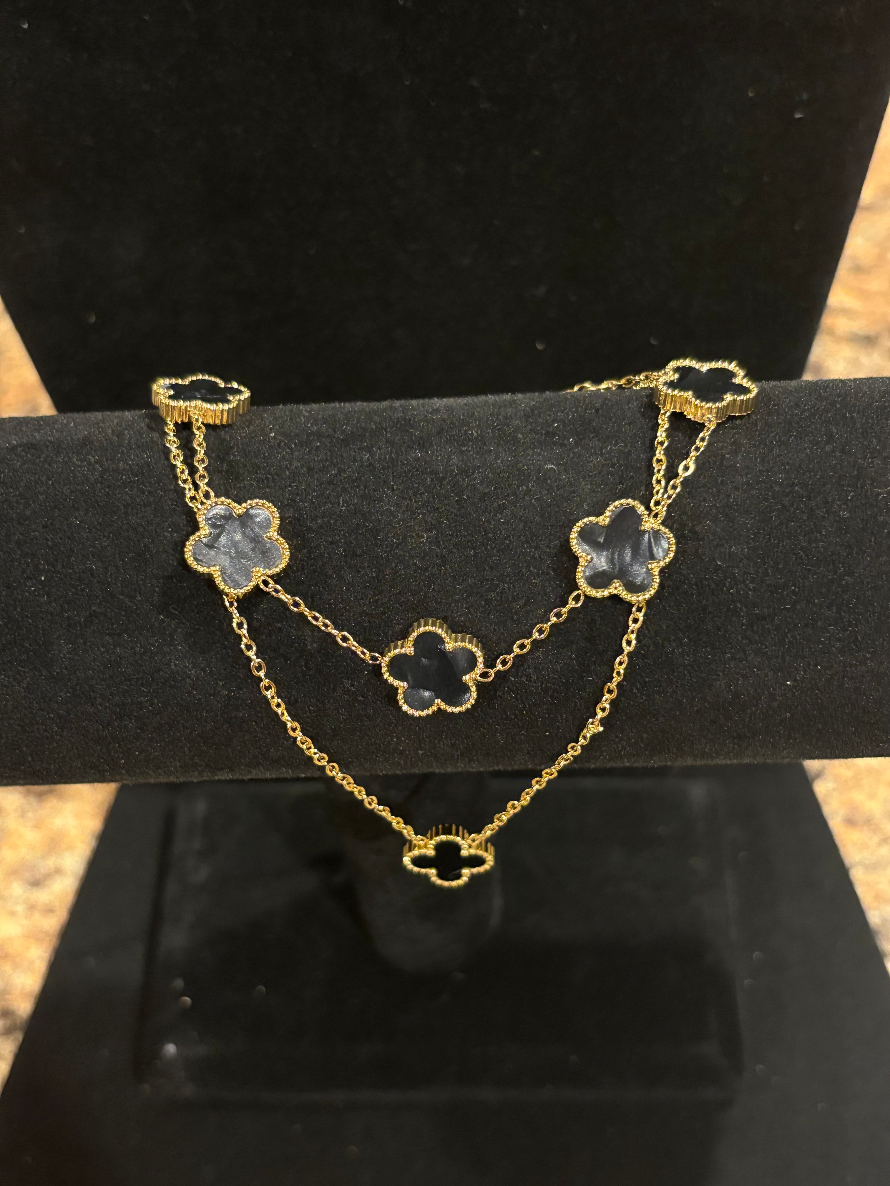 Noir Enchantment: Gold-Plated Black Clover Necklace & Bracelet Set