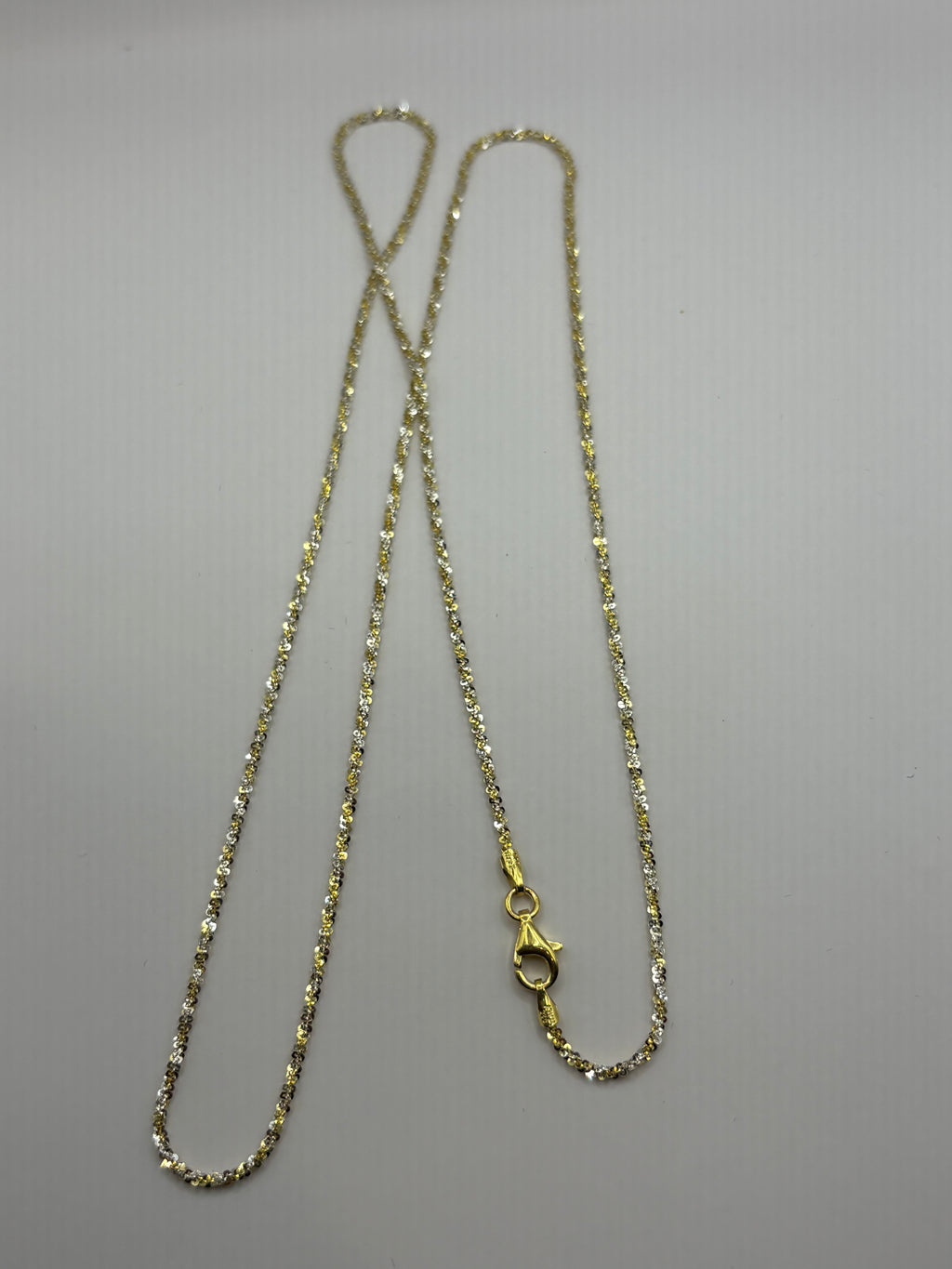 Twisted rock chain features a textured, spiral design crafted to reflect light from every angle