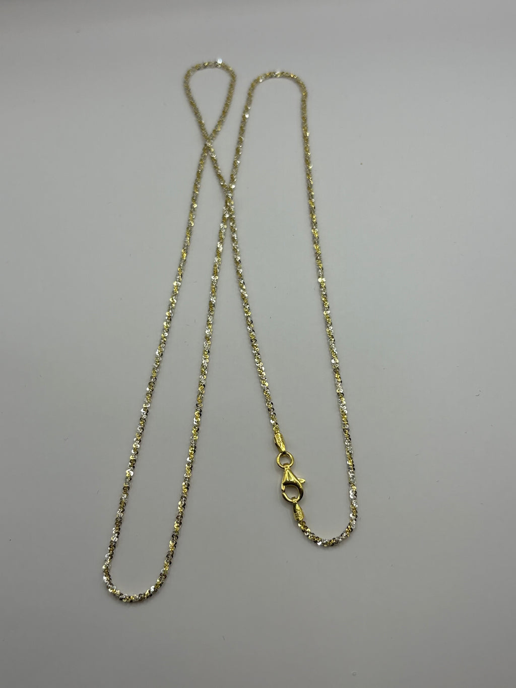 Twisted rock chain features a textured, spiral design crafted to reflect light from every angle