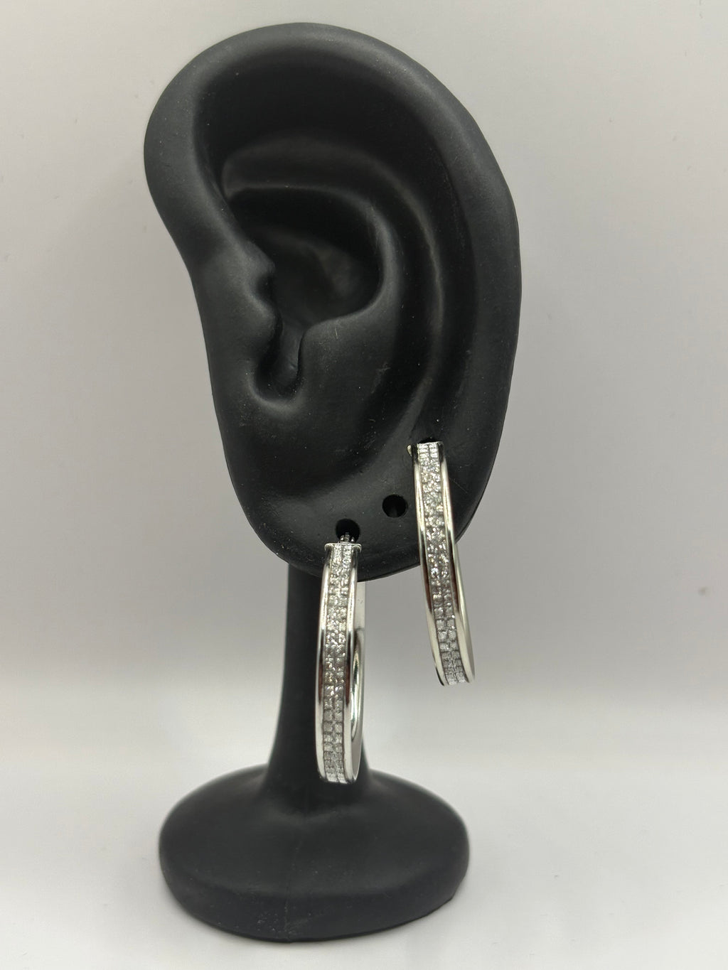These classic hoop earrings feature a refined dual-row pave channel setting