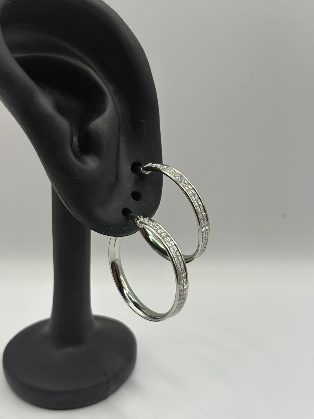 These classic hoop earrings feature a refined dual-row pave channel setting