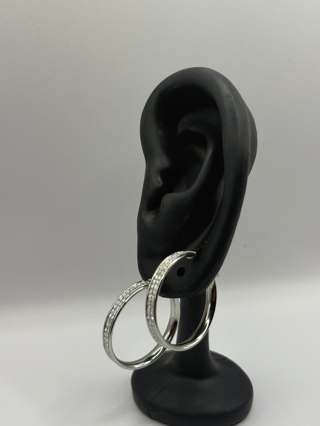 These classic hoop earrings feature a refined dual-row pave channel setting