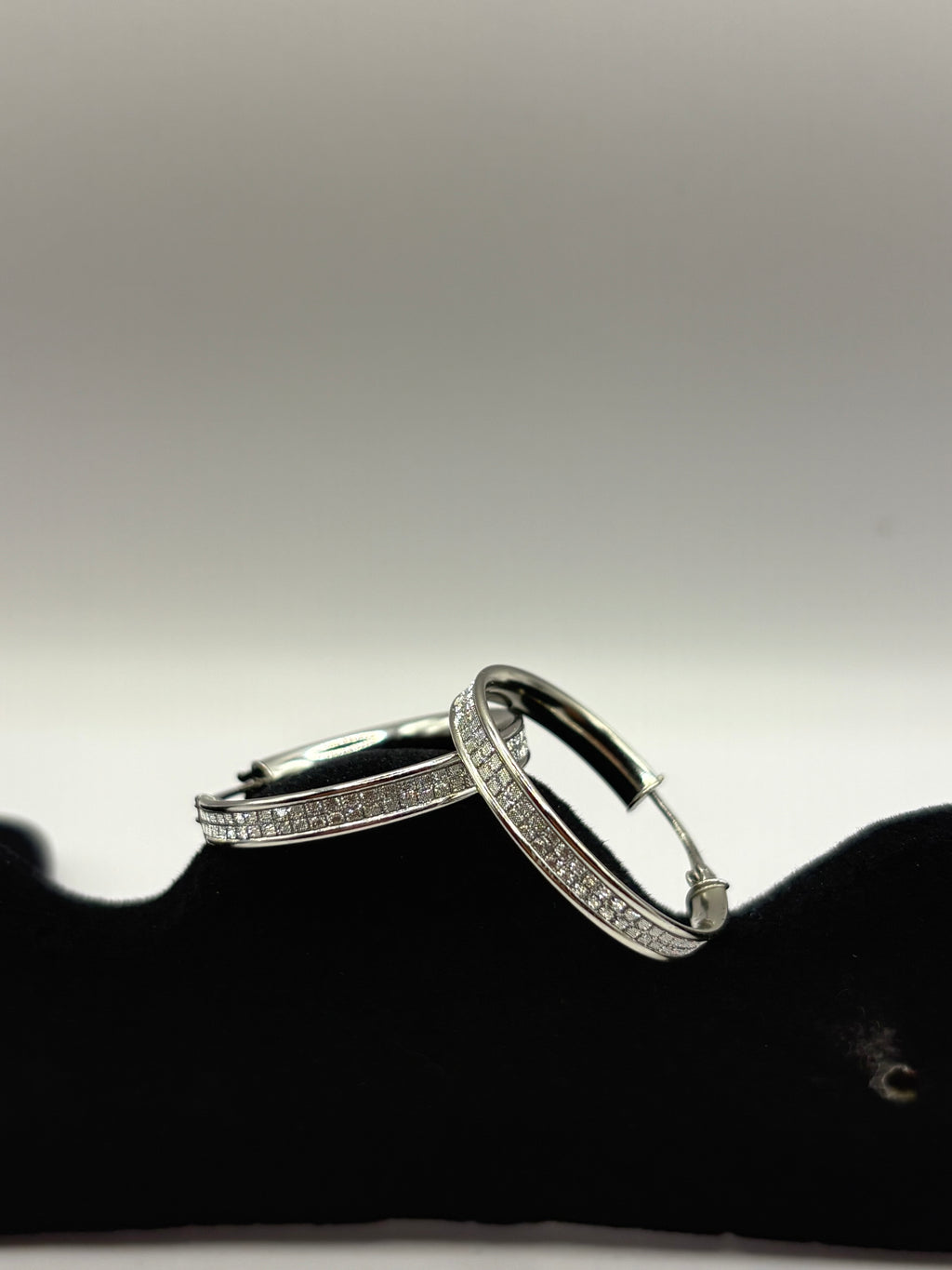These classic hoop earrings feature a refined dual-row pave channel setting