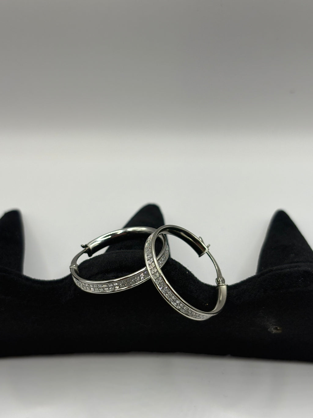These classic hoop earrings feature a refined dual-row pave channel setting