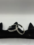 These classic hoop earrings feature a refined dual-row pave channel setting