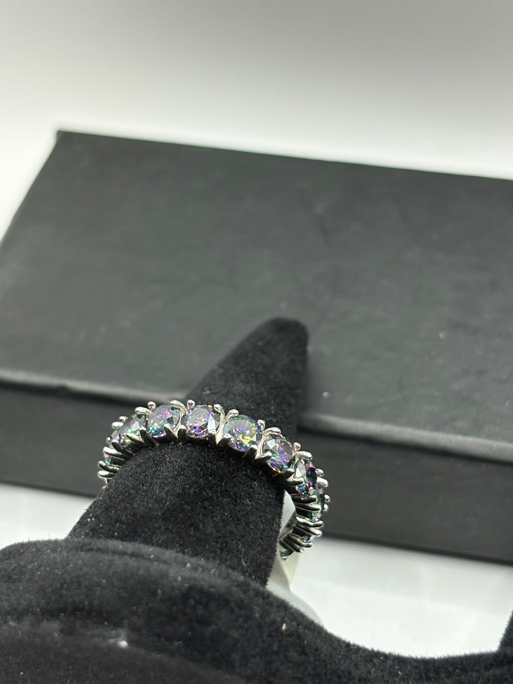 Mystic Topaz Eternity Ring combines continuous brilliant-cut gemstones with a sleek, polished finish