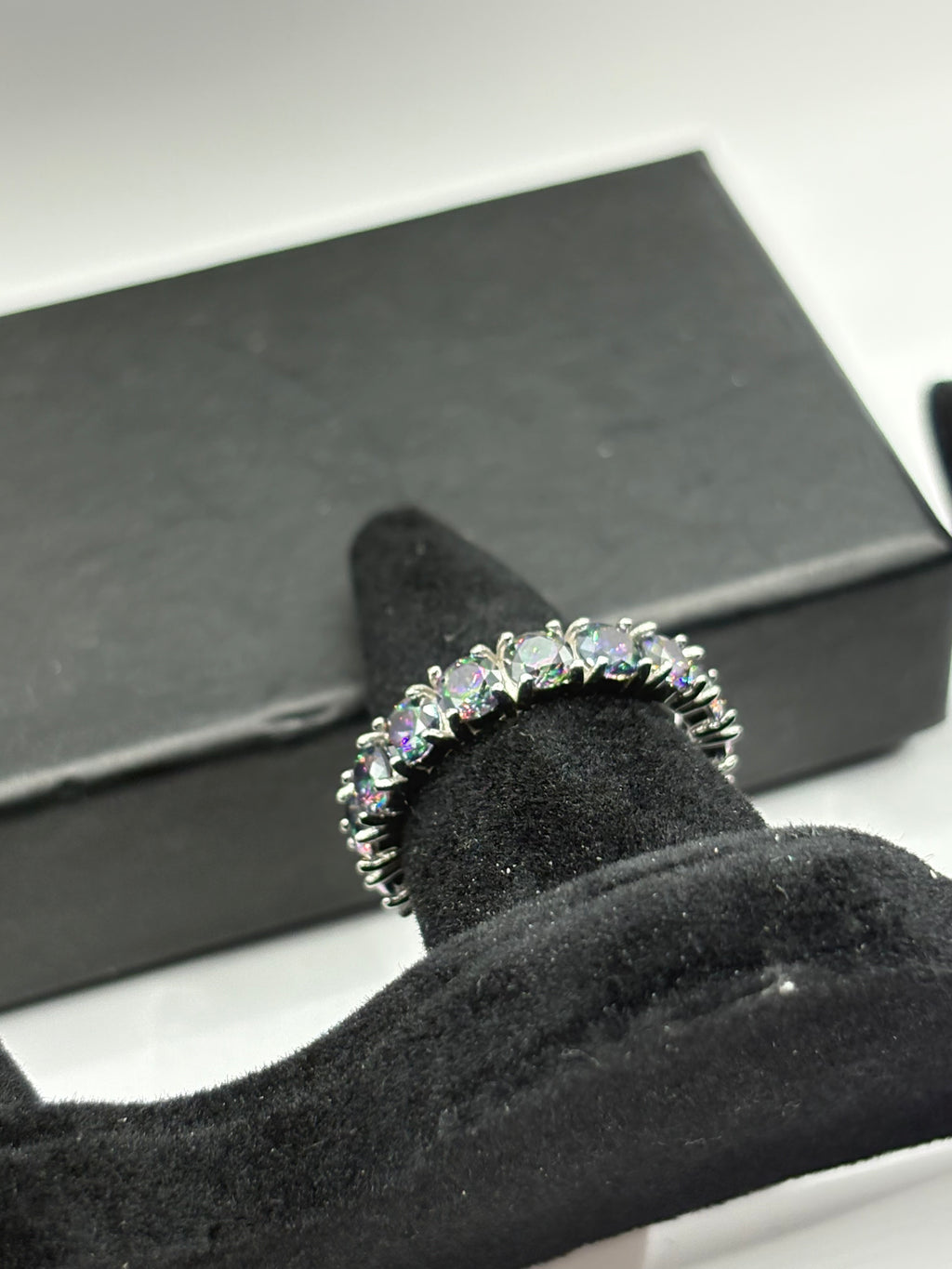 Mystic Topaz Eternity Ring combines continuous brilliant-cut gemstones with a sleek, polished finish