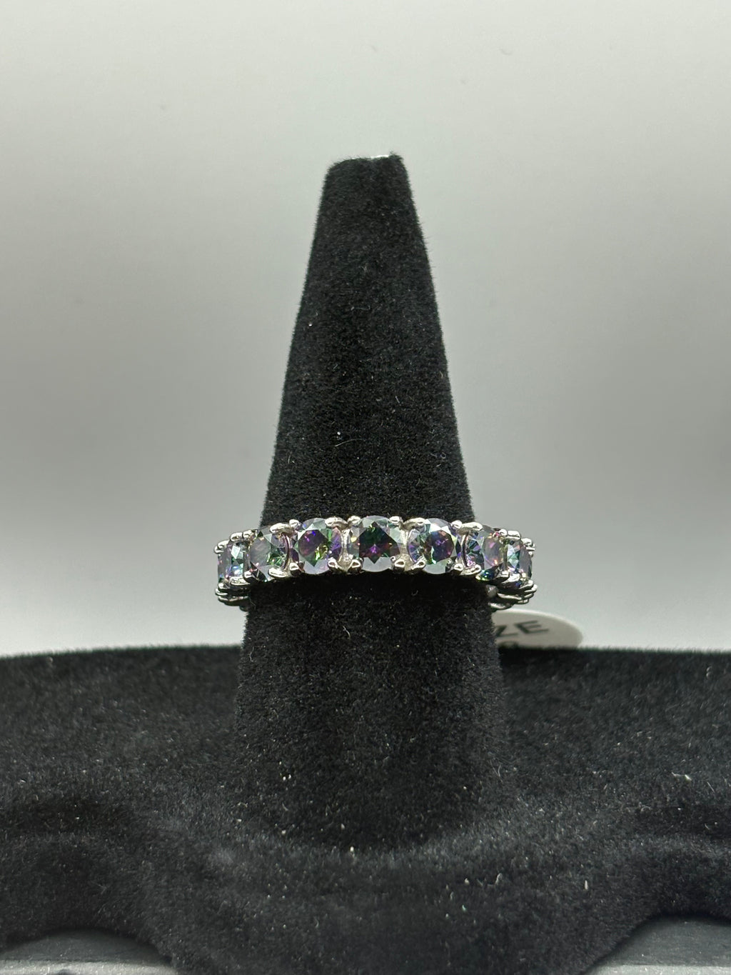 Mystic Topaz Eternity Ring combines continuous brilliant-cut gemstones with a sleek, polished finish