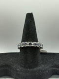 Mystic Topaz Eternity Ring combines continuous brilliant-cut gemstones with a sleek, polished finish