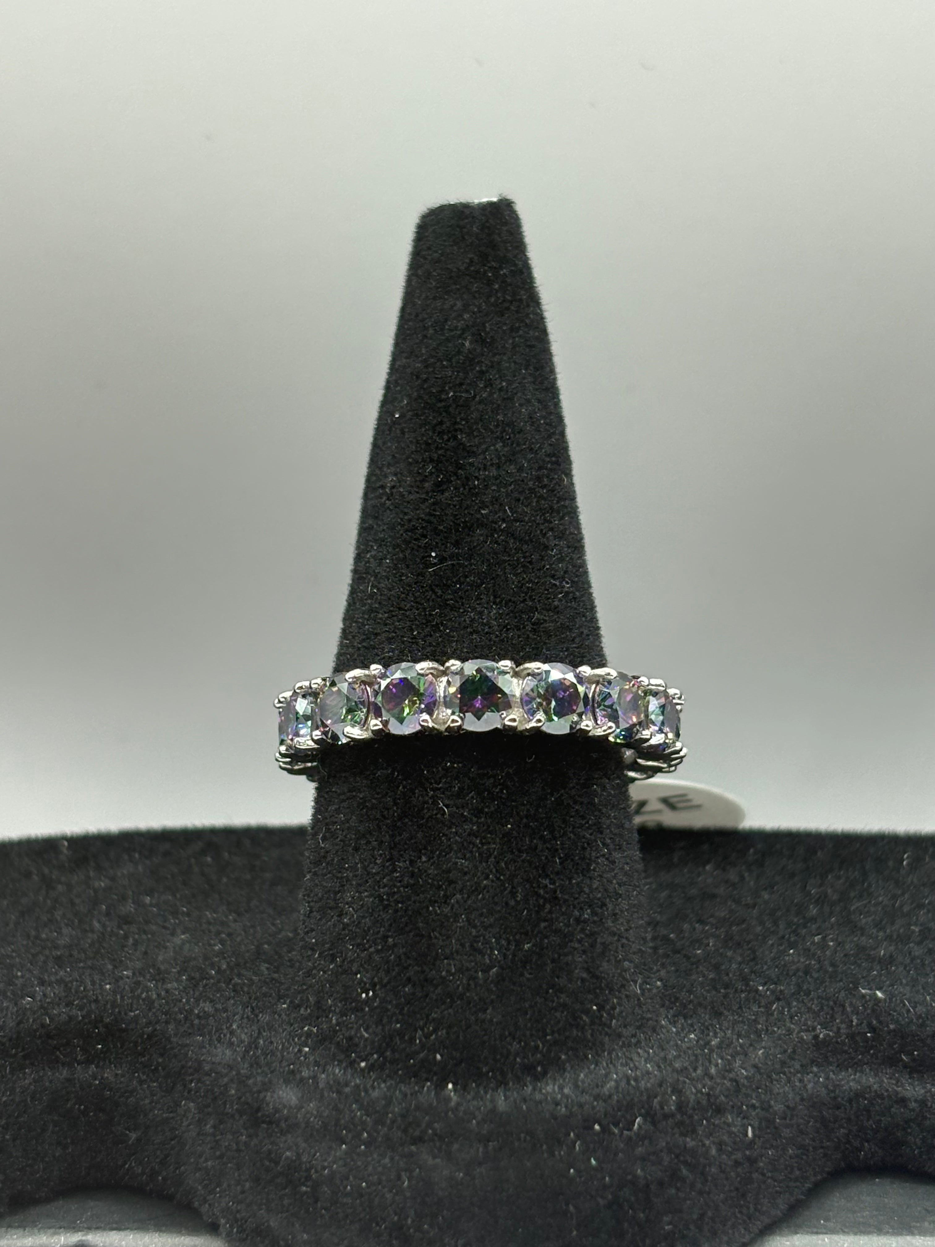 Mystic Topaz Eternity Ring combines continuous brilliant-cut gemstones with a sleek, polished finish